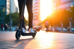 Close up of unrecognizable man riding a scooter at the city street, photo