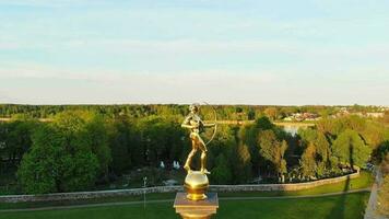 Siauliai, Lithuania - 2nd June, 2021 - Aerial view statue of Golden boy in Siauliai, Lithuania, Europe travel destination. video