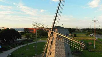 Panning aerial view traditional lithuanian old wooden XIX century horizontal windmill architecture in Siauliai city, Lithuania video