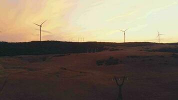 Aerial view five wind turbines standing in green field with beautiful sky background panorama. Copy paste renewable energy concept background video