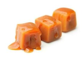 Caramel candies and caramel topping. photo