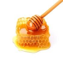 Honeycomb with honey on white backgrounds.AI generative photo