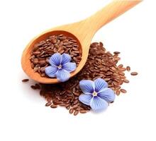 Flax seed and flax flowers closeup on white backgrounds. . photo