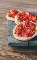 Mini Margherita pizzas with red cheese photo