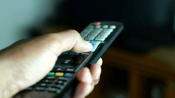 Close up of man hand holding tv remote video