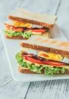 Sandwiches with fried egg and bacon photo