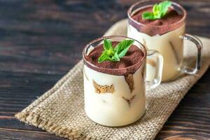 Two glass mugs of tiramisu photo