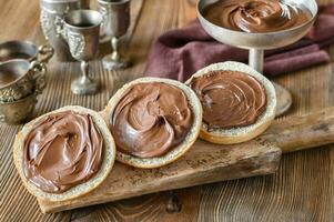 Slices of bread with chocolate paste photo