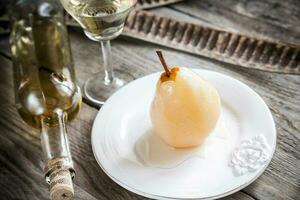 Pear poached in white wine photo