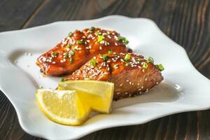 Teriyaki salmon on the white plate photo