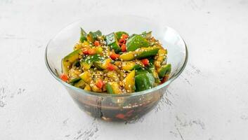 Bowl of Chinese smashed cucumber salad photo