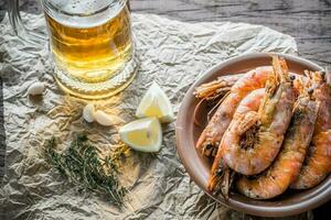 Fried shrimps with glass of beer photo