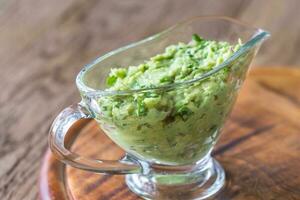 Guacamole in glass gravy-boat photo