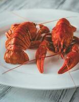 Dish of boiled crayfish with sauce photo