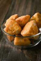 Brie fritters in glass bowl photo