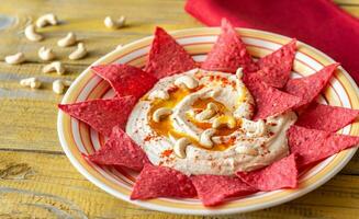 Hummus with tortilla chips photo