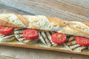 Sandwich with grilled aubergines and cherry tomatoes photo