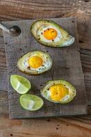 Baked eggs in avocado photo