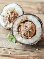 Chocolate ice cream in the coconut halves photo