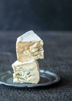 Soft cheese with white and blue mold photo