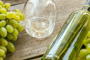 White wine with bunch of grape photo