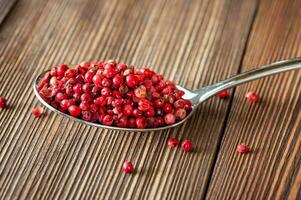 Spoon of red peppercorn photo