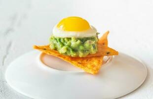 Guacamole and  quail egg appetizer photo