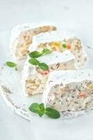 White nougat with fresh mint leaves photo