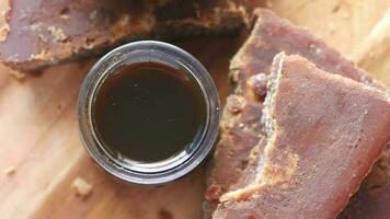 Stack of Jaggery traditional cane sugar cube on table video