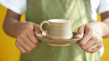 Young man serving cup of tea video