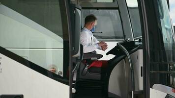 Public Transit Operator With Protective Mask On Inside Of Bus video