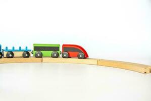 Children's railway made of wood on a white background. photo