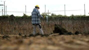 Caucasian Construction Site Supervisor Taking Conversation Using Walkie Talkie Device While Looking Around the Site. video