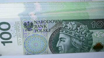 Close Up Of Stack Of One Hundred Zloty Of Foreign Currency Being Counted. video