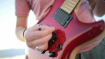 Rockman with the Guitar. Closeup Photo. Modern Electric Guitar String Instrument. video