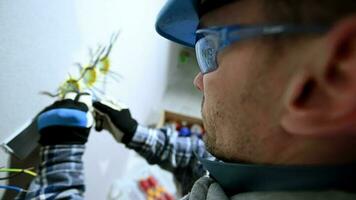 Close Up Shot Of Caucasian Laborer In 30s Screwing On Wire Connector. video