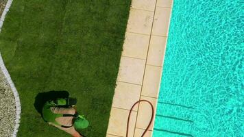 Finishing Natural Lawn Installation By Swimming Pool. video