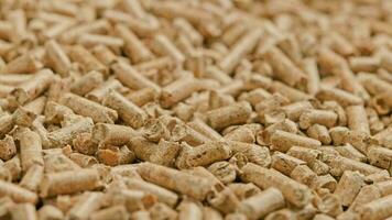 looped close-up rotation of compacted wooden sawdust pellets video