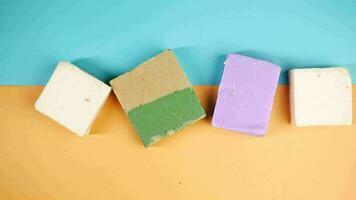 Homemade natural soap bar on black background video