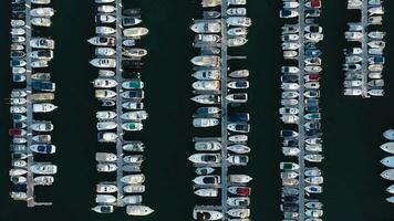 Top view of the dock with a lot of yachts and boats - shooting from a drone video