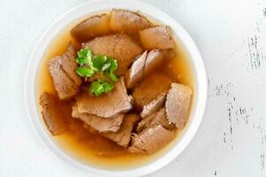 Bowl of beef bone broth photo