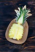 Pineapple on the wooden board photo