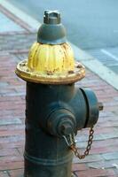 Rusty street hydrant on the street. Boston photo