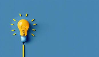 Idea concept with yellow light bulb on blue background, photo