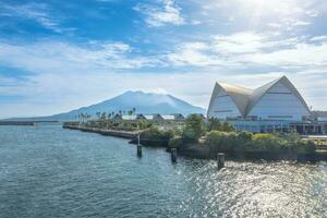 Sakurajima mountain, sea and blue sky background, Kagoshima, Kyushu, Japan photo