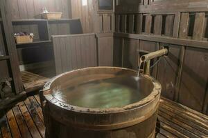 Wooden bamboo barrel bath onsen, Japanese hot spring photo