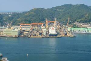 Nagasaki,Kyushu,Japan - October 24, 2018 Panorama view of Nagasaki city and Nagasaki port with montain background, cityscape photo