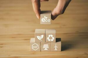 Wooden block of CO2 emission reduction icons. environment, global warming, CO2, sustainable energy concept. photo