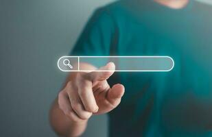 Business man searching information data on internet on toolbar browser. Searching technology and data information concept. photo
