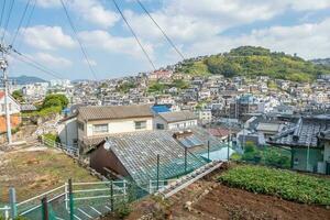 Panorama view of Nagasaki city with montain and  blue sky background, Cityscape, Nagasaki, Kyushu, Japan photo